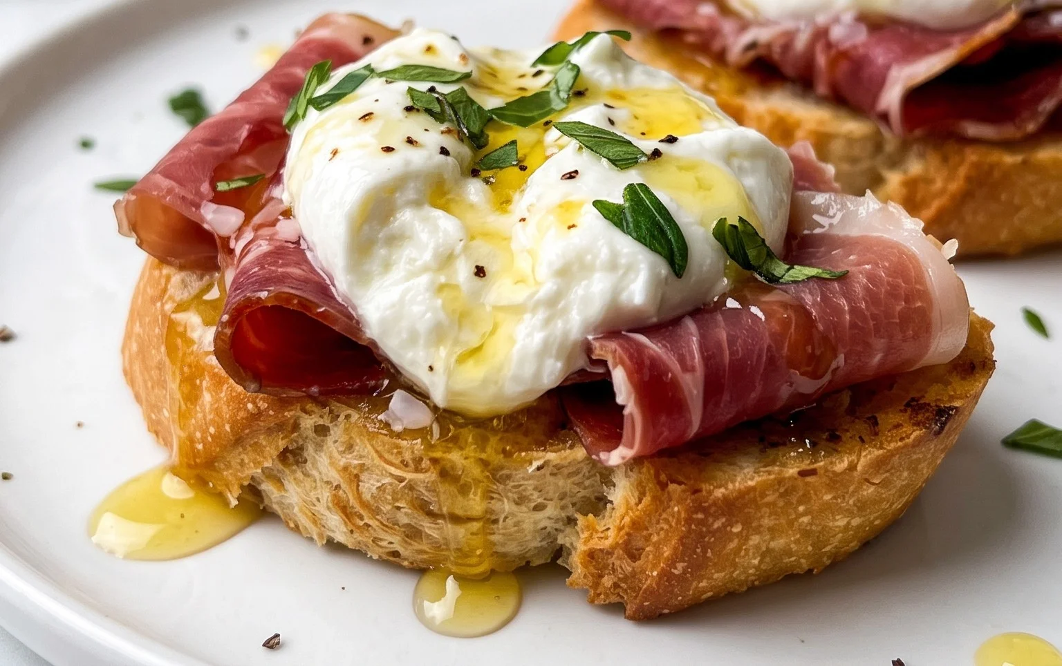 Beef Prosciutto Crostini with Burrata and Lemon Honey Drizzle